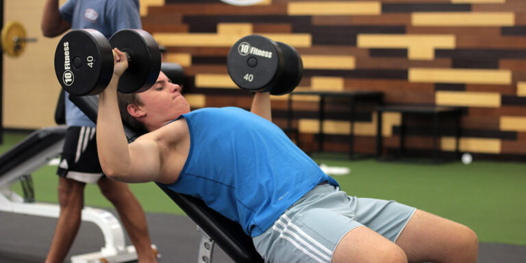 a man working out with weights at the North Little Rock club