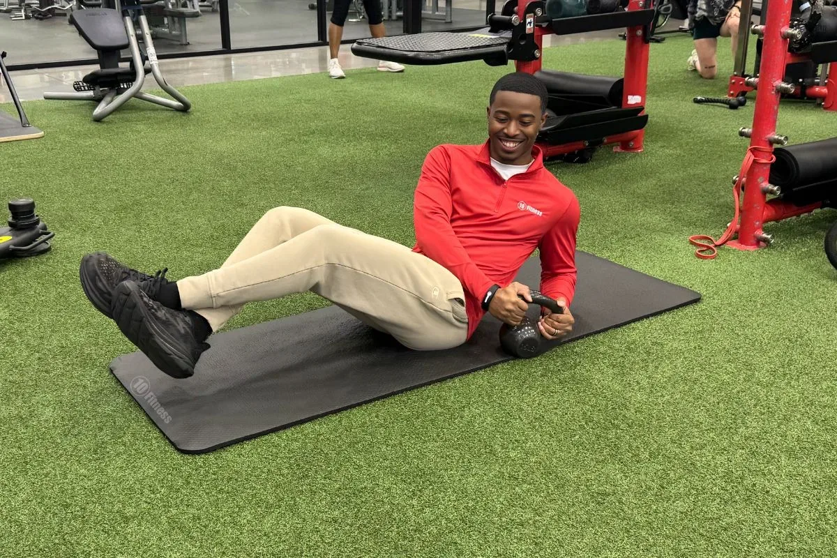 Beginner performing core exercises at 10 Fitness gym
