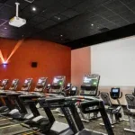 Cardio Cinema theater room at 10 Fitness Bowman