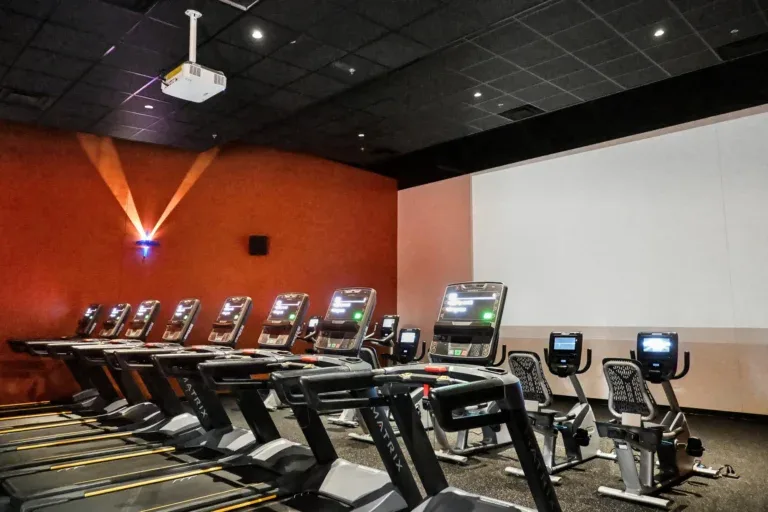 Cardio Cinema theater room at 10 Fitness Bowman