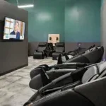 Massage chairs in the recovery area at 10 Fitness Bowman