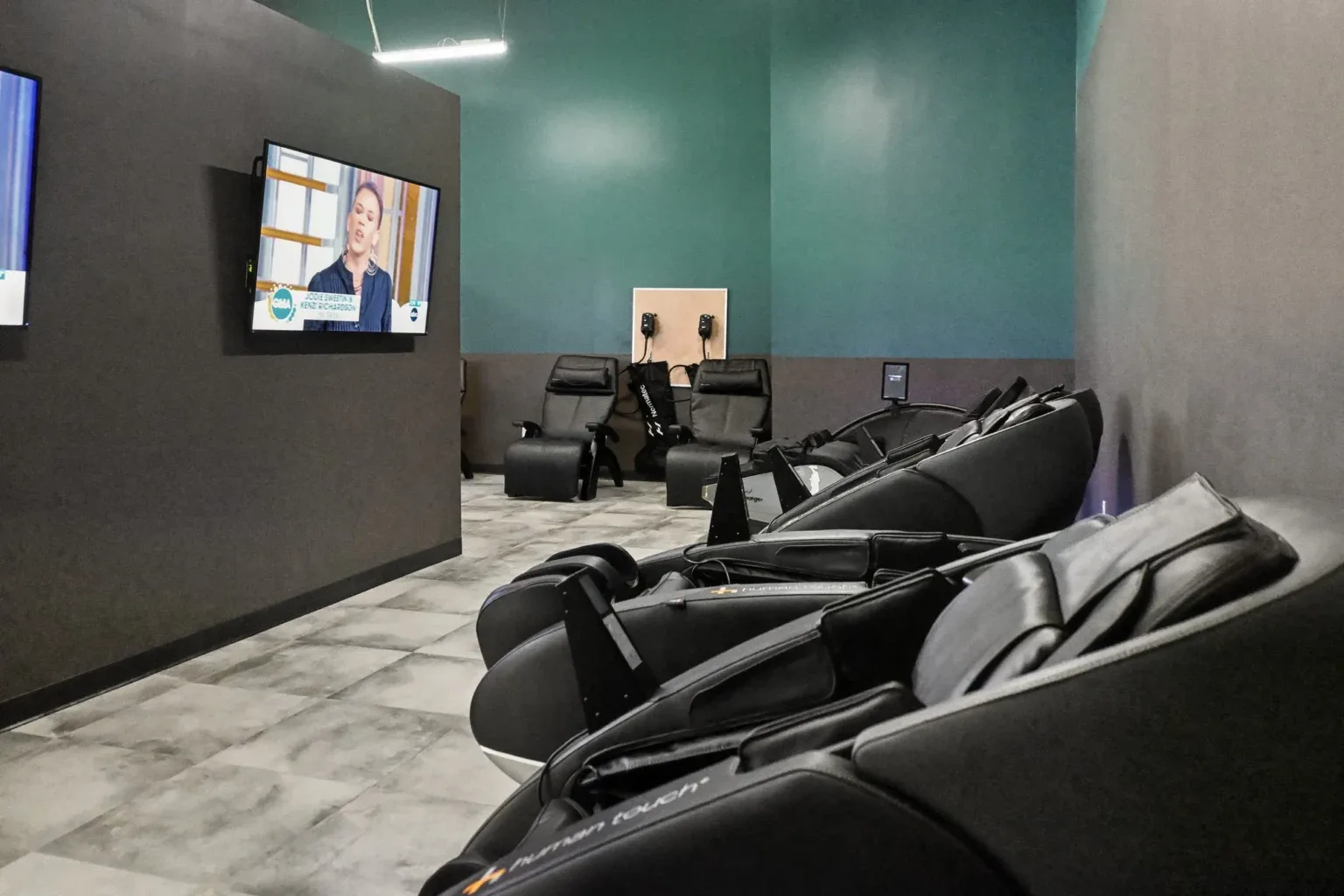 Massage chairs in the recovery area at 10 Fitness Bowman