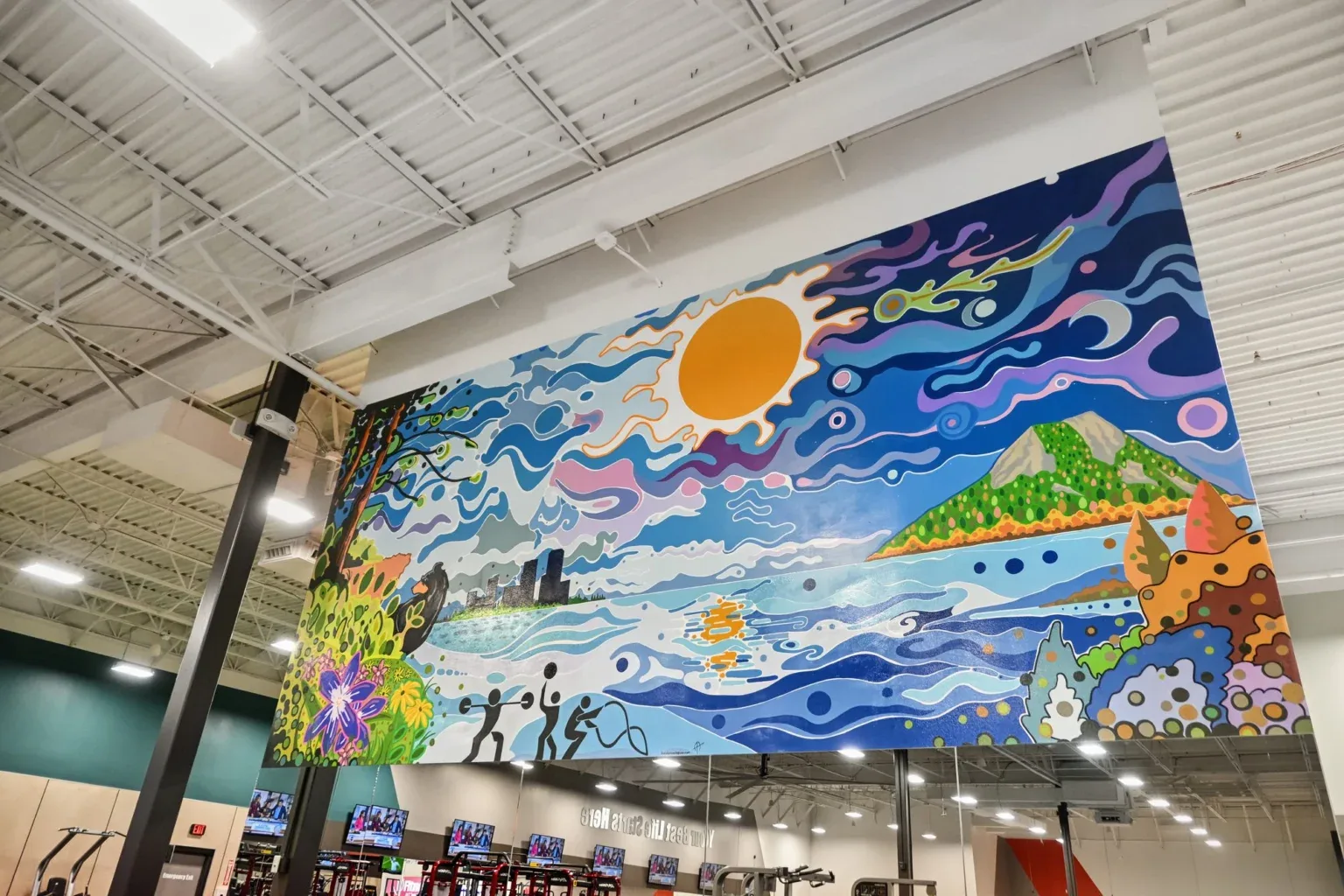 Large colorful mural overlooking the workout floor at 10 Fitness Bowman