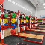 Olympic lifting platforms and color bumper plates at 10 Fitness Bowman