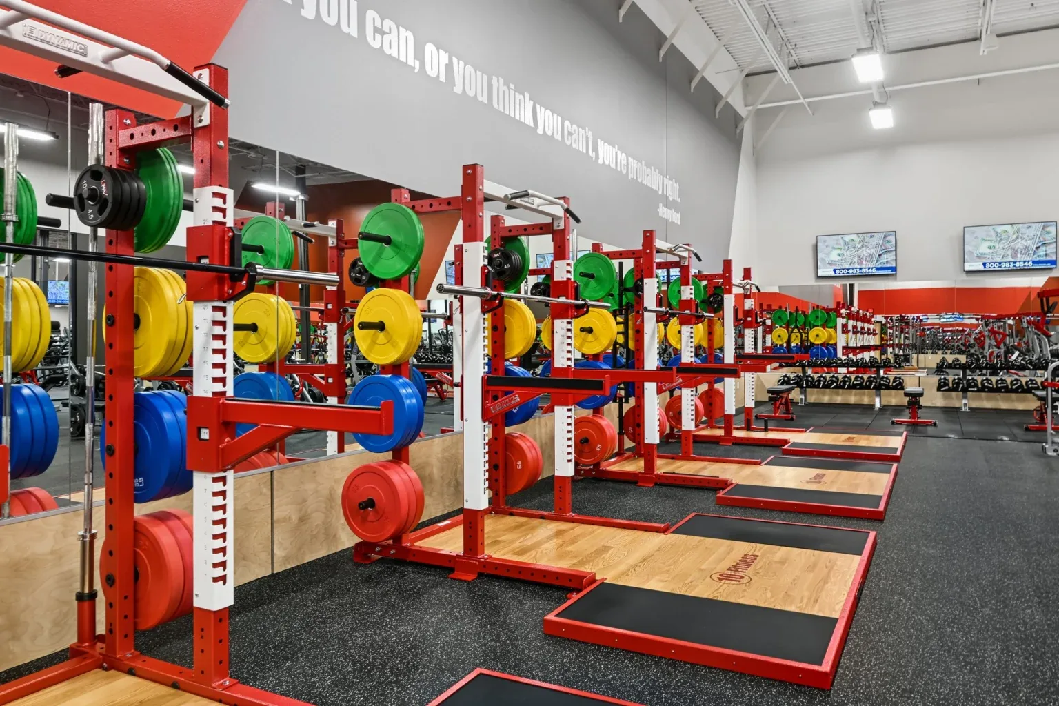 Olympic lifting platforms and color bumper plates at 10 Fitness Bowman