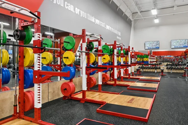 Olympic lifting platforms and color bumper plates at 10 Fitness Bowman